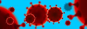 Närbild på rött virus mot ljusblå bakgrund